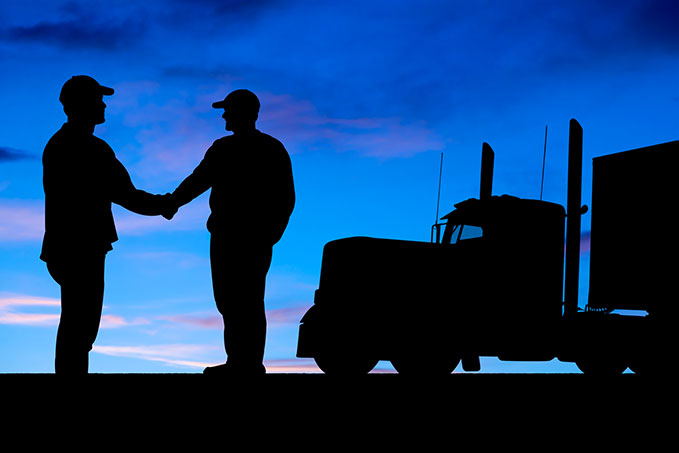 truck drivers shaking hands